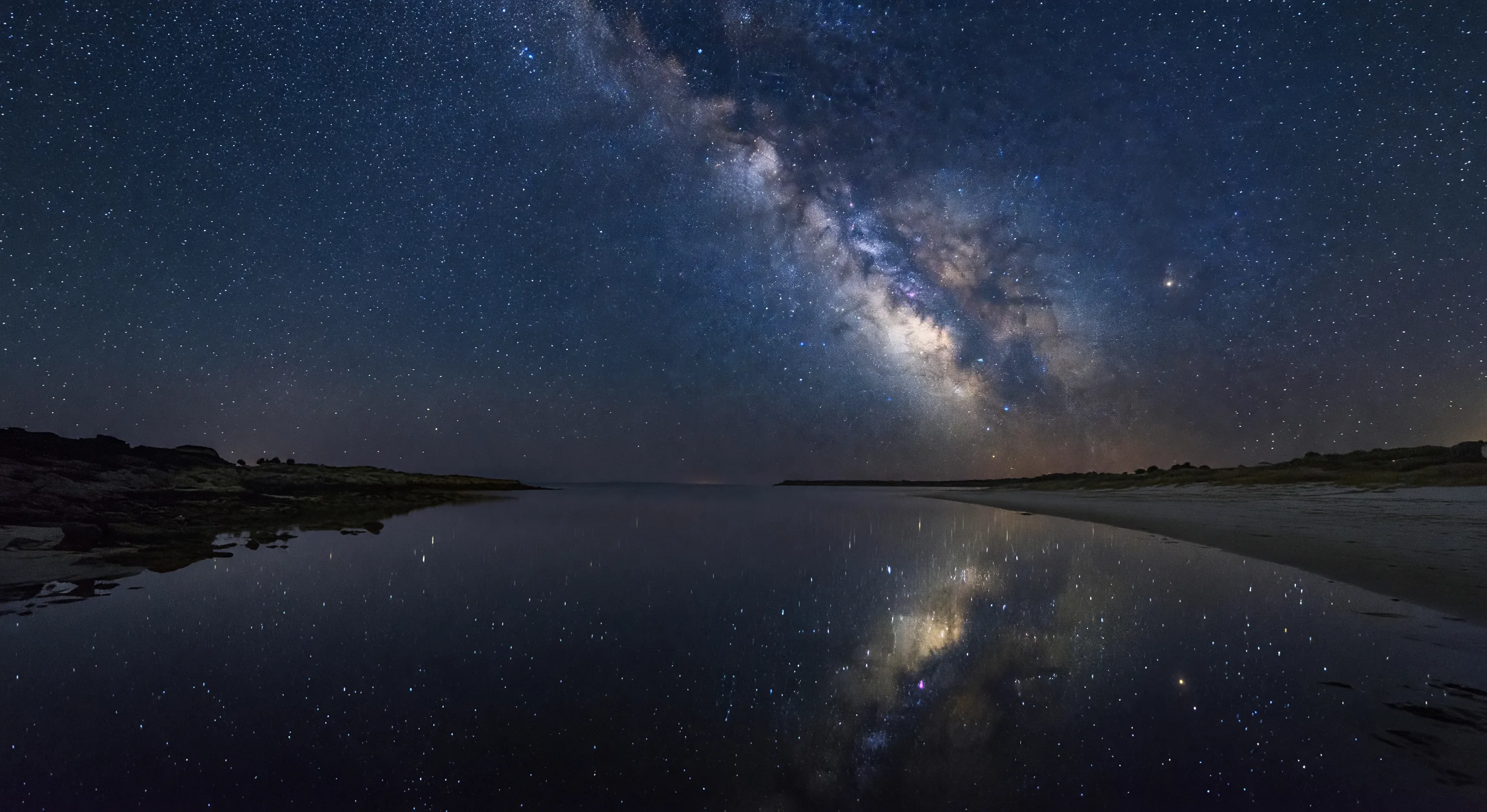 Starry night over coastal lagoon
